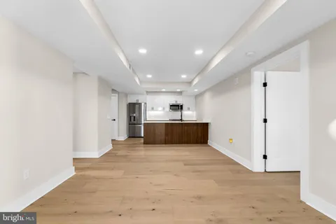 a view of kitchen and empty room