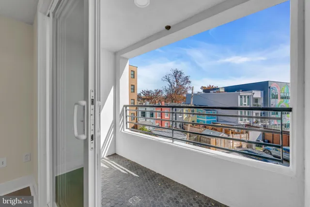 a view of a balcony with city view