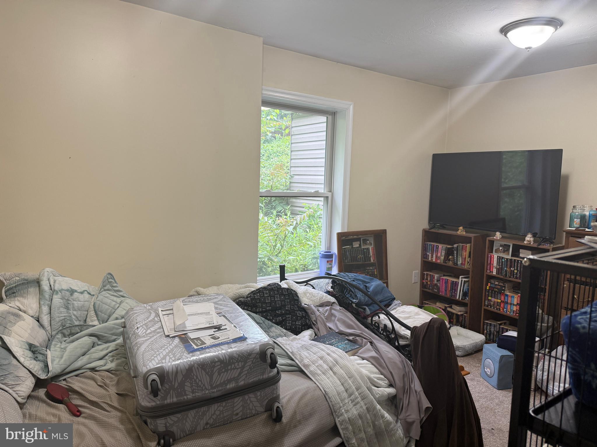 4810 Fake Road York, PA 17406 - Photo 14 of 58 a bedroom with a bed and a flat screen tv