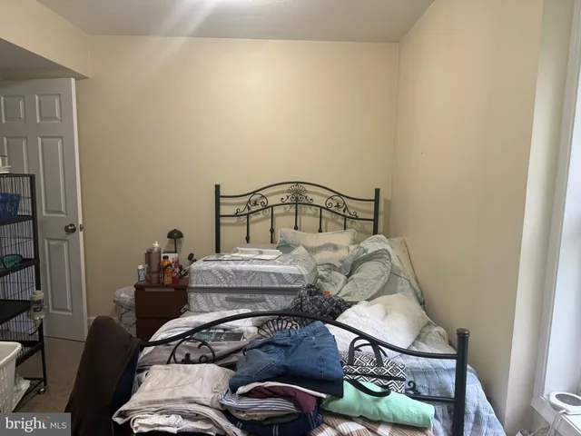 a bedroom with a bed and a closet
