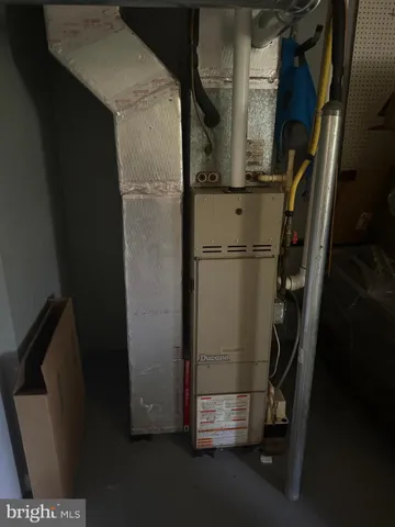 a bed room with bed and a window