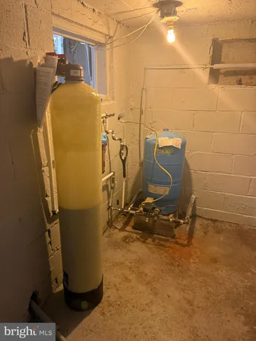 a front view of a house with a garden and parking