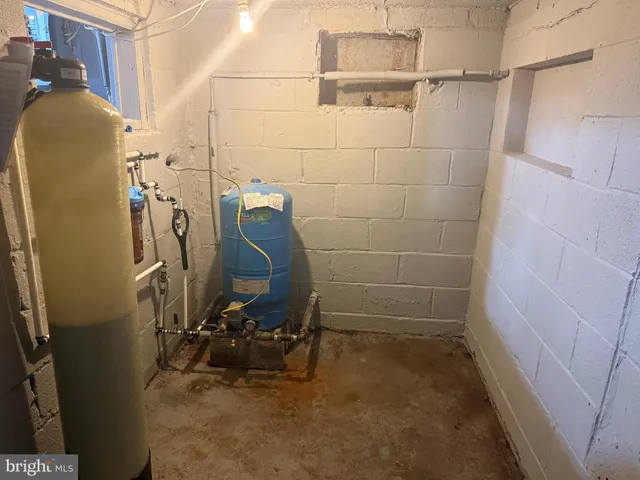 a view of a backyard with table and chairs and wooden fence