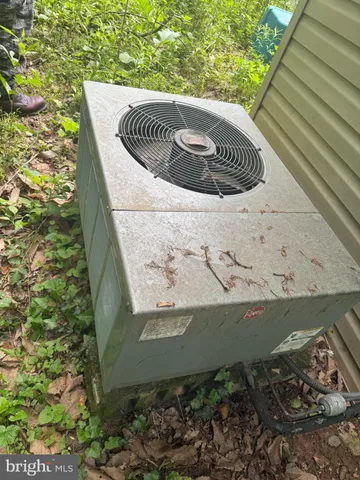 a view of a house with a yard and deck