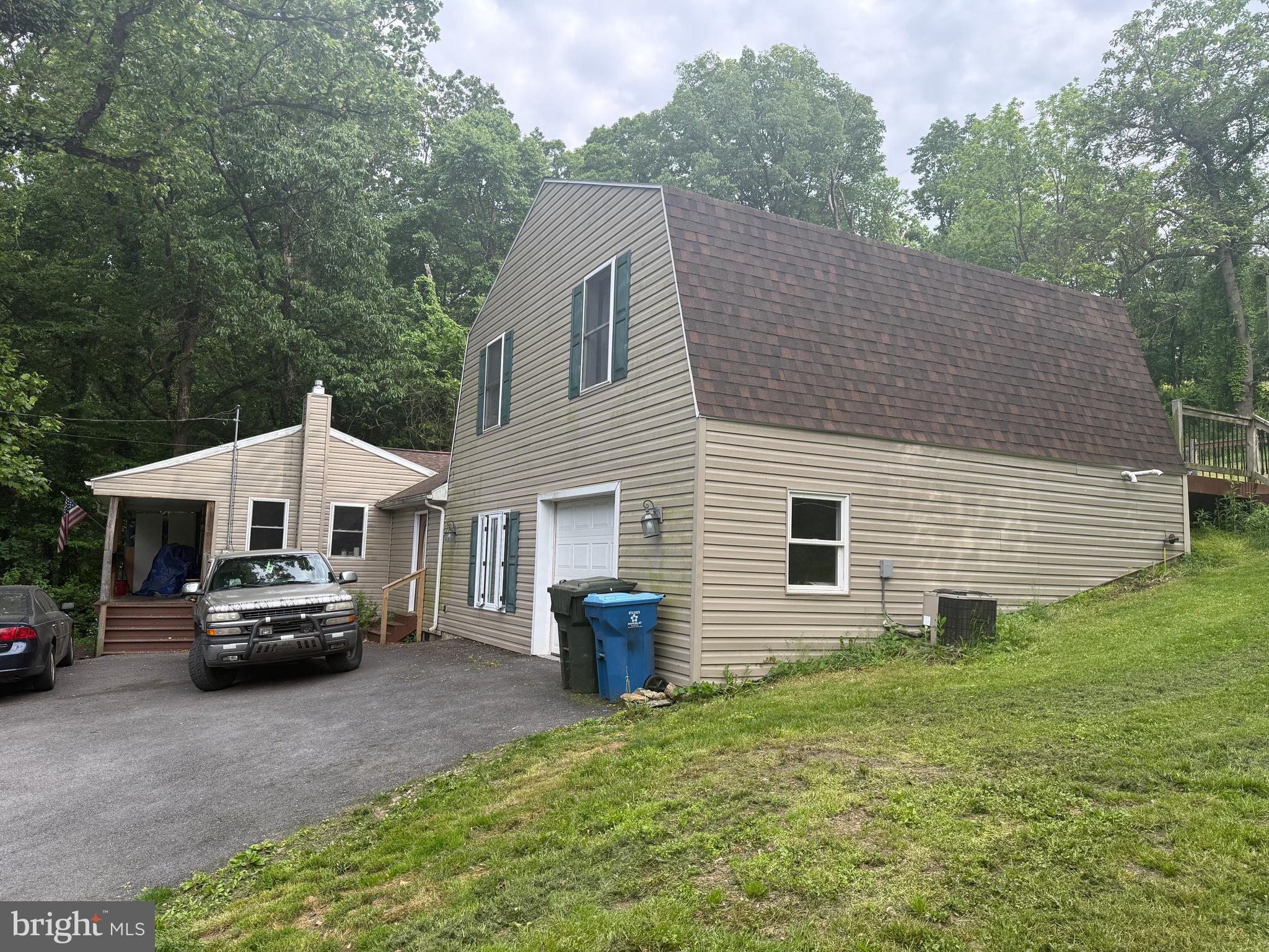 4810 Fake Road York, PA 17406 - Photo 49 of 58 a front view of a house with a garden and parking
