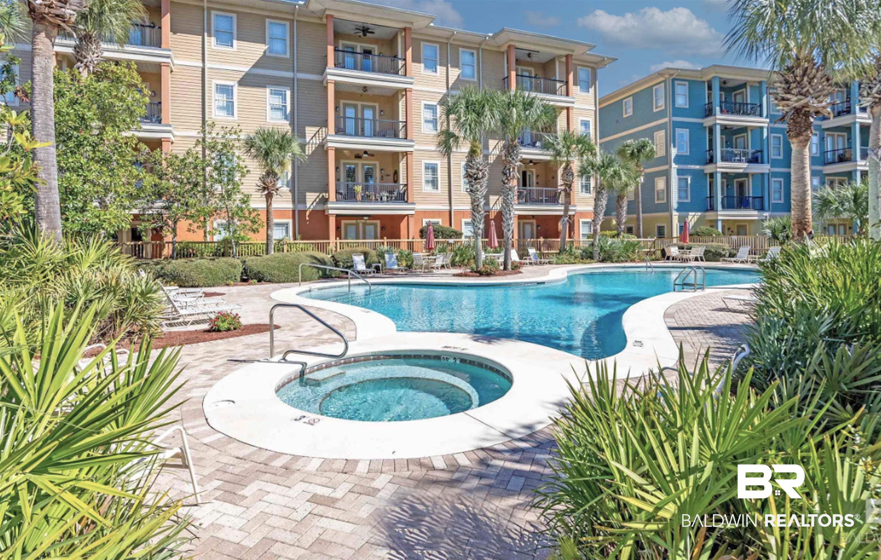 1430 Regency Road, Unit 301C Gulf Shores, AL 36542 - Photo 2 of 22 View of swimming pool with a hot tub