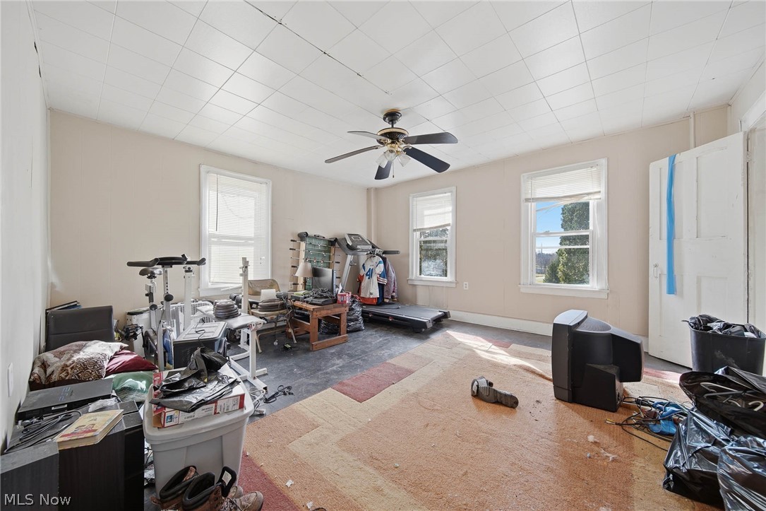 4677 Rock Spring Road Ravenna, OH 44266 - Photo 17 of 35 Workout area featuring a ceiling fan and baseboards