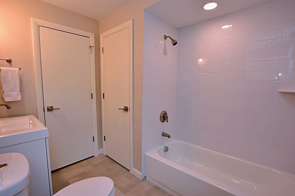 11 Sandy Avenue Canton, MA 02021 - Photo 11 of 20 a bathroom with a granite countertop sink a toilet and bathtub