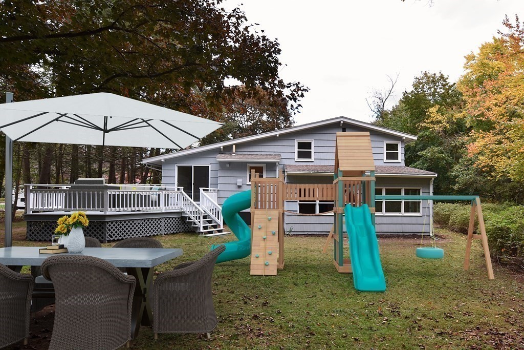 11 Sandy Avenue Canton, MA 02021 - Photo 14 of 20 a view of a house with a yard patio and sitting area