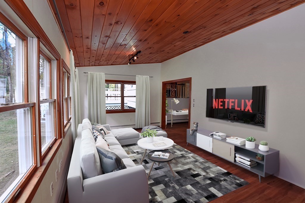 11 Sandy Avenue Canton, MA 02021 - Photo 6 of 20 a living room with furniture wooden floor and a flat screen tv
