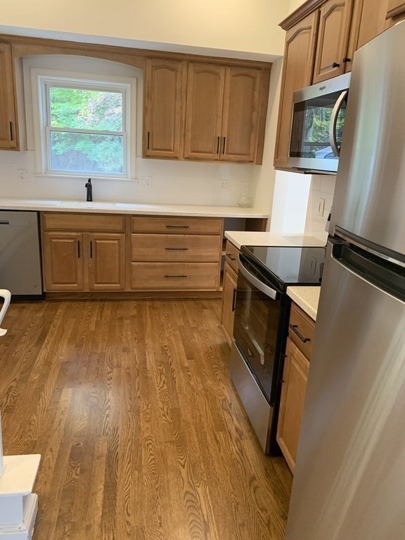 11 Sandy Avenue Canton, MA 02021 - Photo 9 of 20 a kitchen with sink cabinets and window