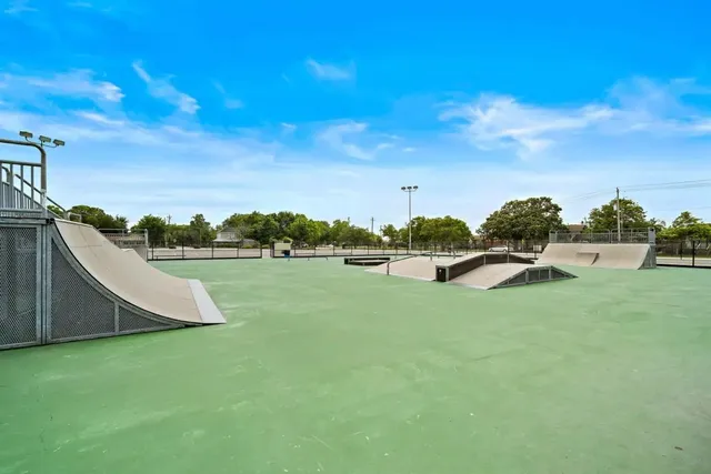 a view of a garden and basketball court