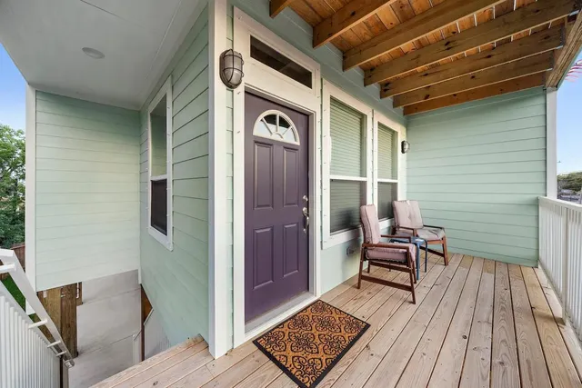 a view of outdoor space wooden floor and windows