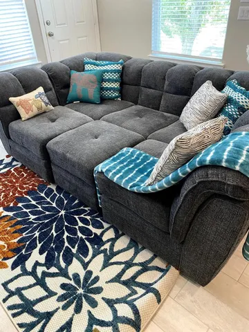 a living room with furniture and window