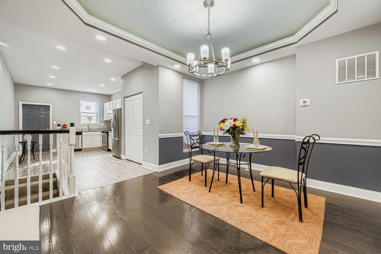 2225 Homewood Avenue Baltimore, MD 21218 - Photo 12 of 29 a view of a dining room with furniture and wooden floor