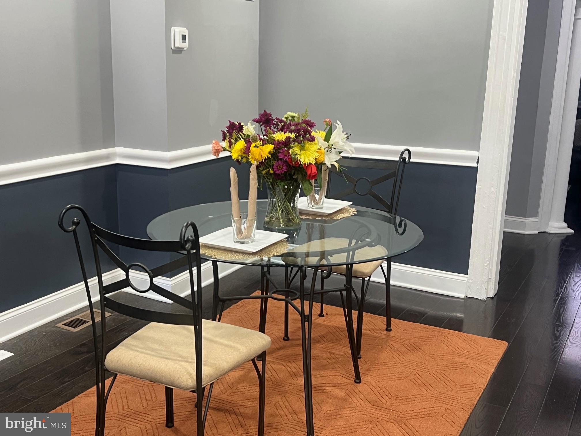 2225 Homewood Avenue Baltimore, MD 21218 - Photo 13 of 29 a view of a dining room with furniture and wooden floor