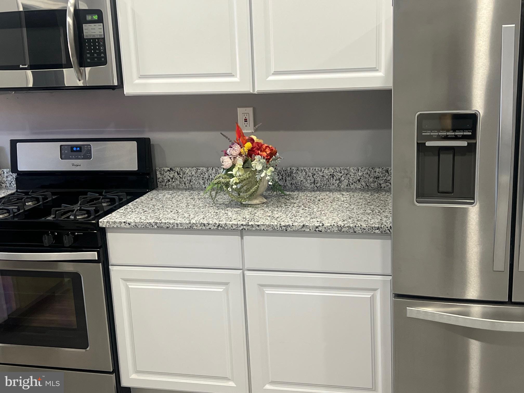 2225 Homewood Avenue Baltimore, MD 21218 - Photo 15 of 29 a kitchen with appliances cabinets and a counter top space