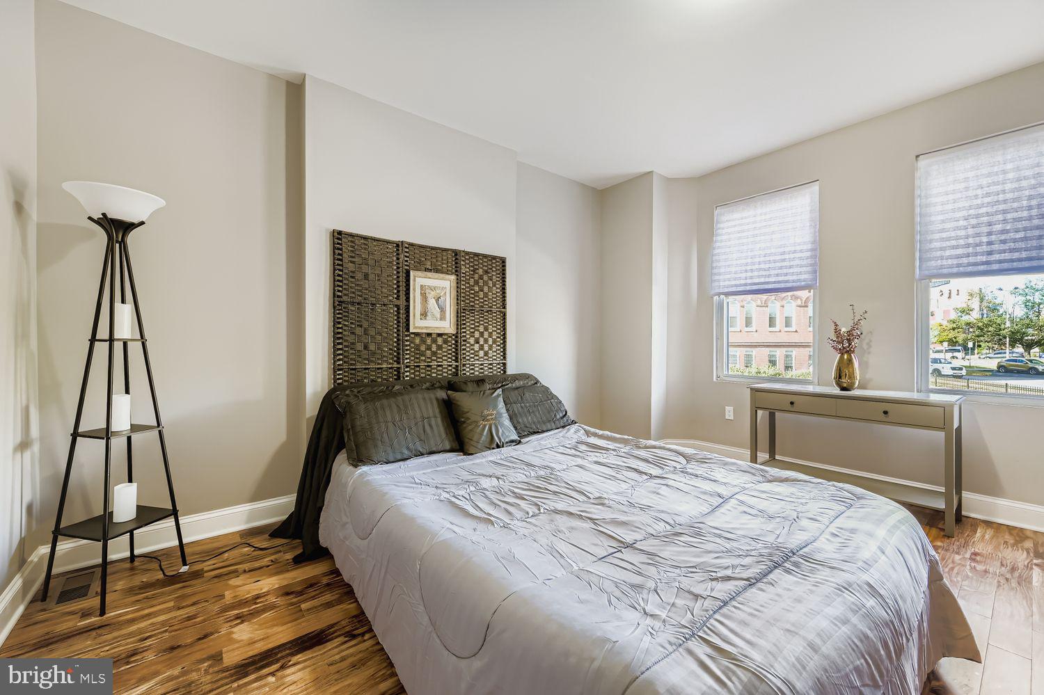 2225 Homewood Avenue Baltimore, MD 21218 - Photo 18 of 29 a bedroom with a bed and a chandelier