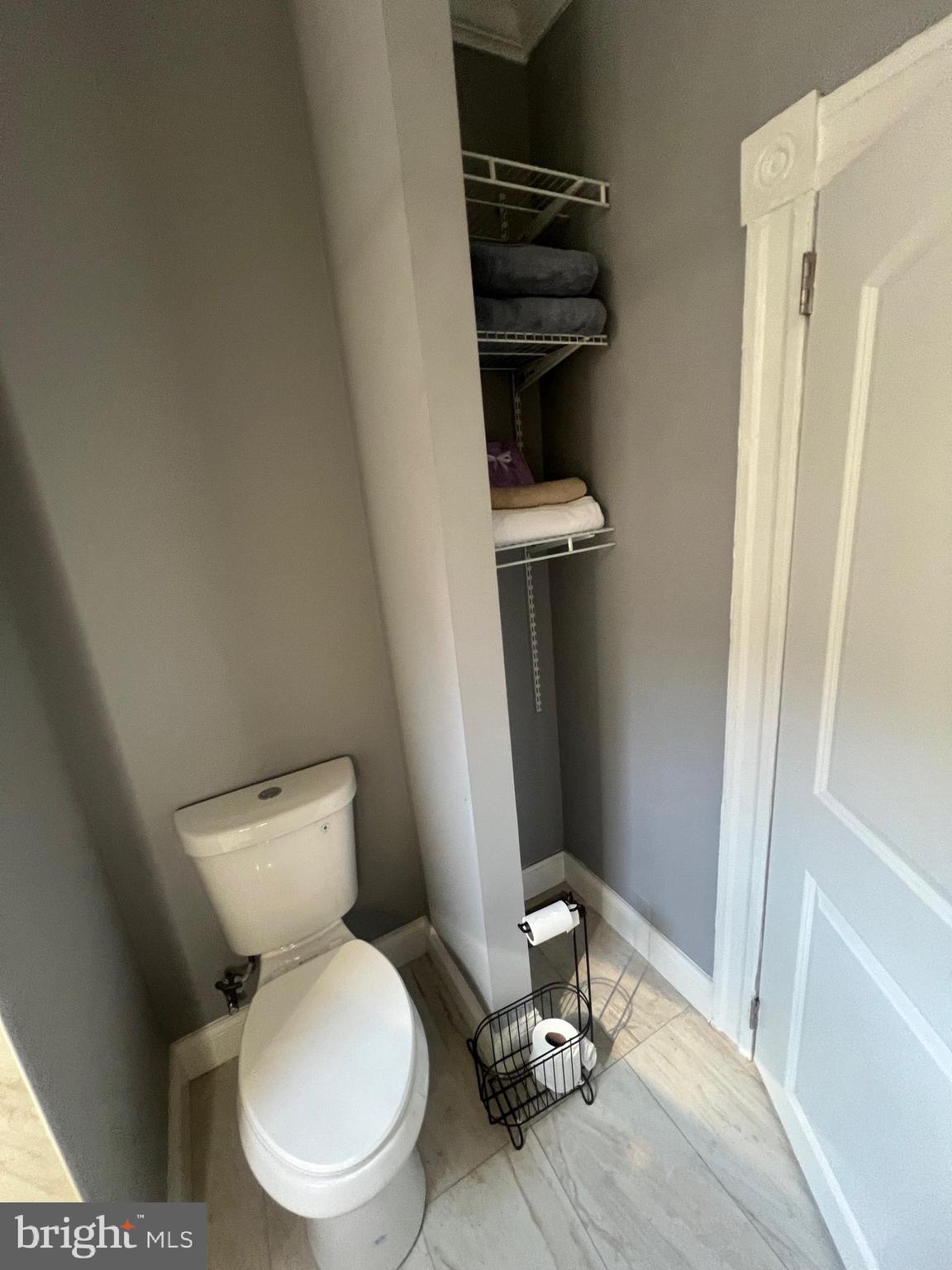 2225 Homewood Avenue Baltimore, MD 21218 - Photo 24 of 29 a white toilet sitting next to a sink