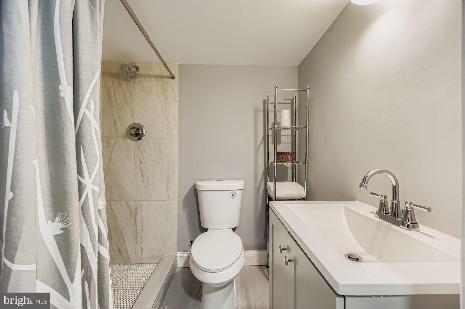 2225 Homewood Avenue Baltimore, MD 21218 - Photo 26 of 29 a bathroom with a sink toilet and shower