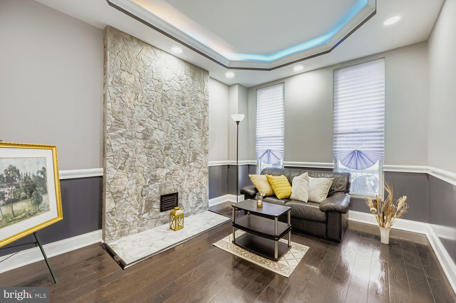 2225 Homewood Avenue Baltimore, MD 21218 - Photo 8 of 29 a living room with furniture and a fireplace