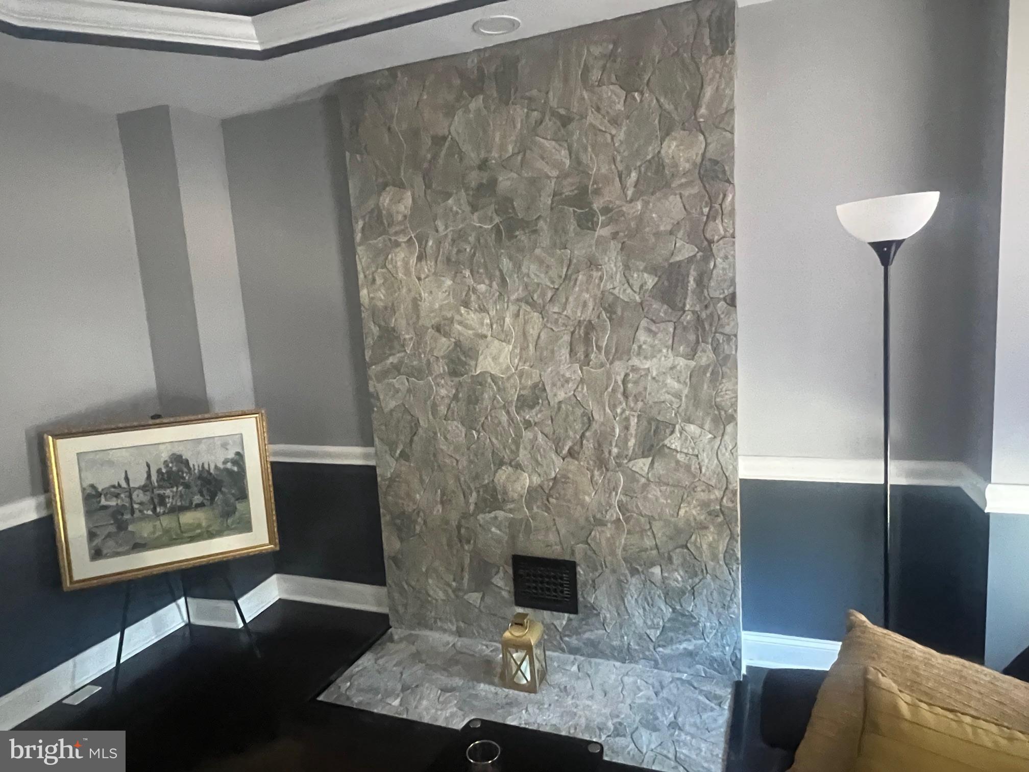 2225 Homewood Avenue Baltimore, MD 21218 - Photo 9 of 29 a living room with furniture and a fireplace