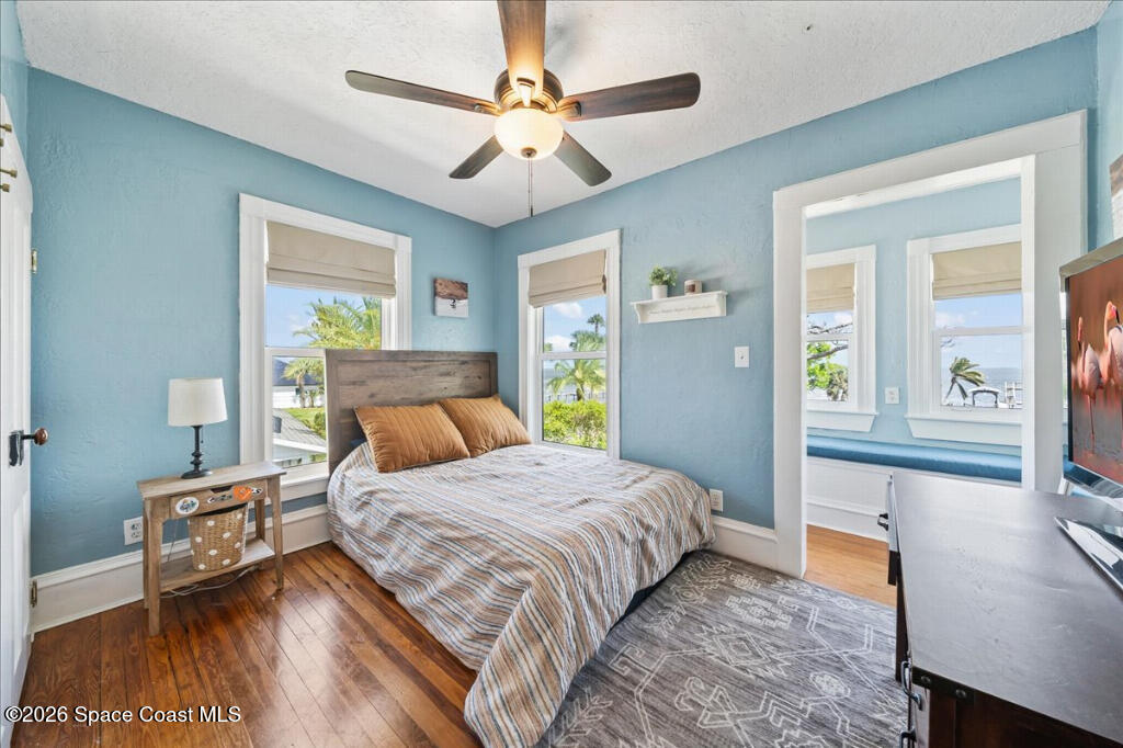 1110 Riverside Drive Titusville, FL 32780 - Photo 23 of 50 a bedroom with a bed window and a dresser