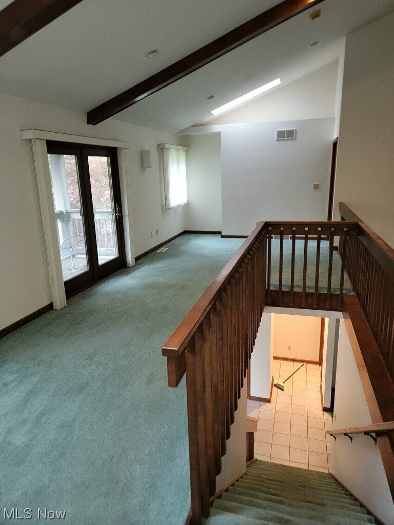 4088 Leffingwell Road Canfield, OH 44406 - Photo 24 of 35 Staircase with vaulted ceiling with beams and light tile flooring