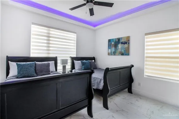 a white toilet sitting next to a bathroom sink