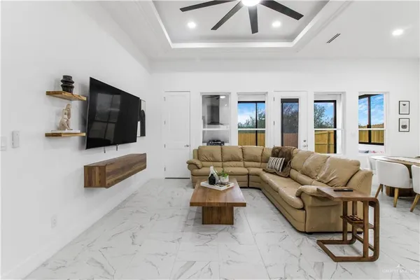 a living room with furniture and a flat screen tv