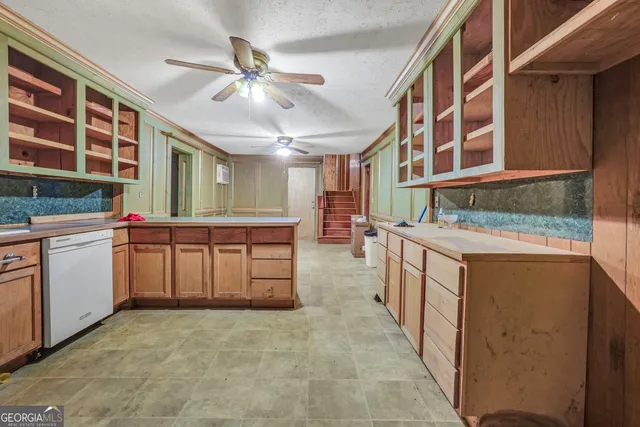 a kitchen with stainless steel appliances granite countertop a stove and a sink