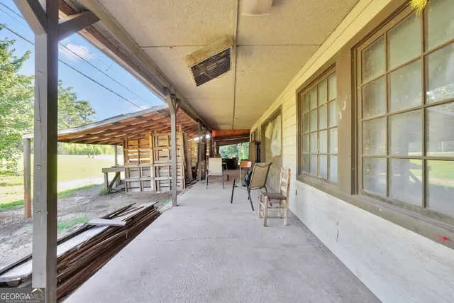 a view of a porch with furniture