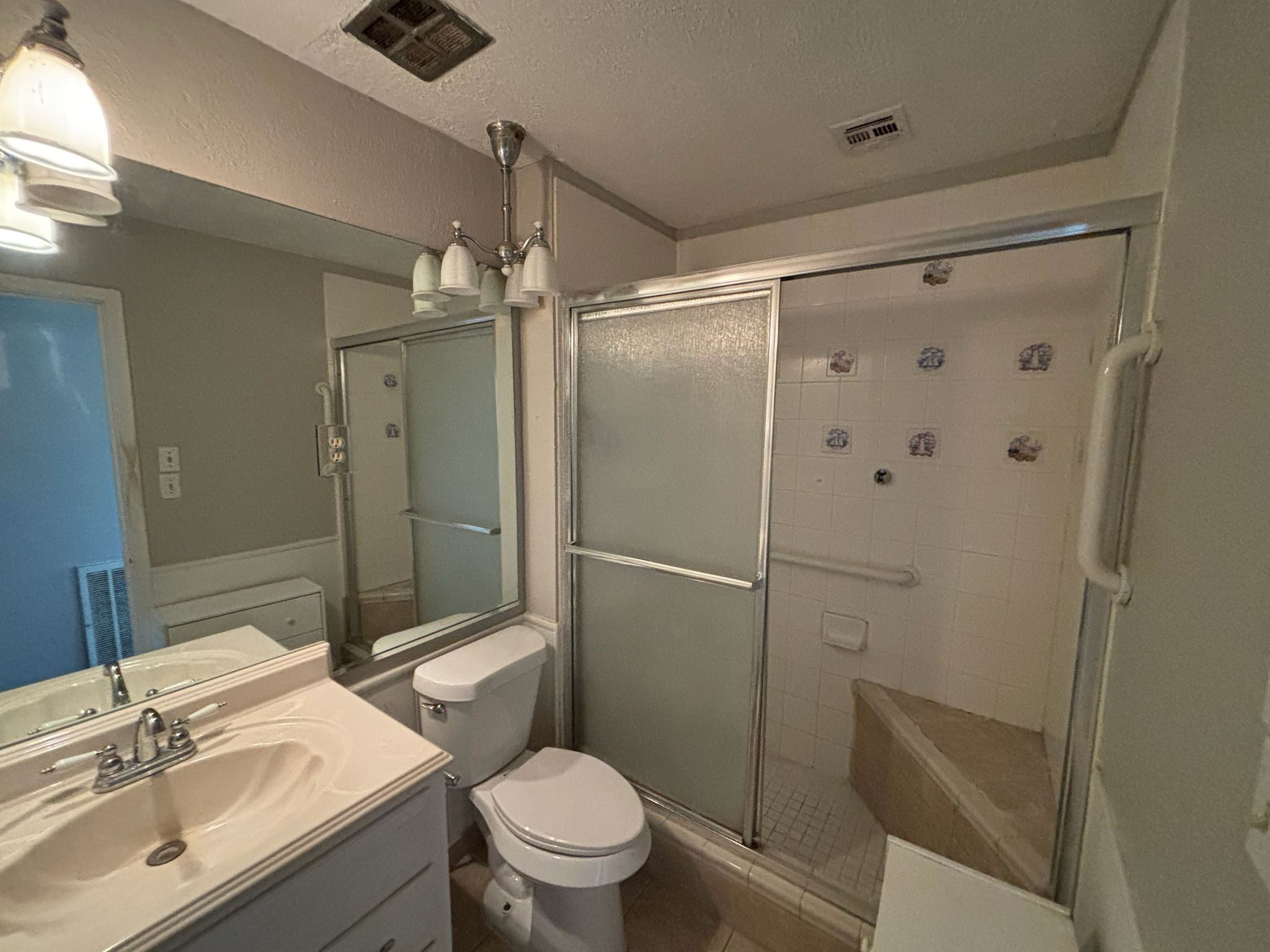 11018 Sharpview Drive Houston, TX 77072 - Photo 7 of 13 a bathroom with a sink toilet and shower