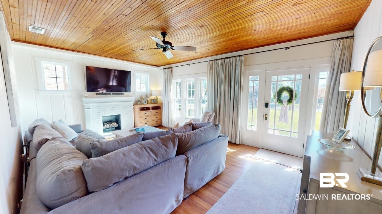 4358 Stein Street Mobile, AL 36608 - Photo 4 of 29 Living room with light wood-type flooring, a healthy amount of sunlight, and wood ceiling