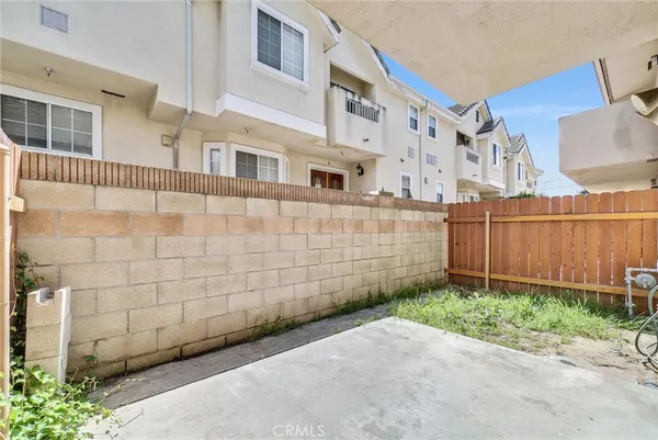 a view of a backyard with a fence