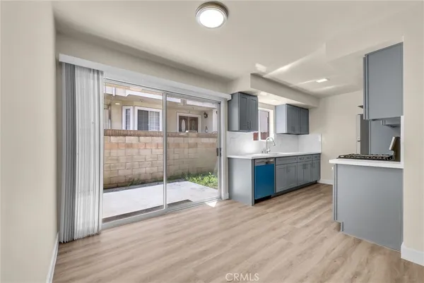a kitchen with stainless steel appliances granite countertop a stove top oven and sink