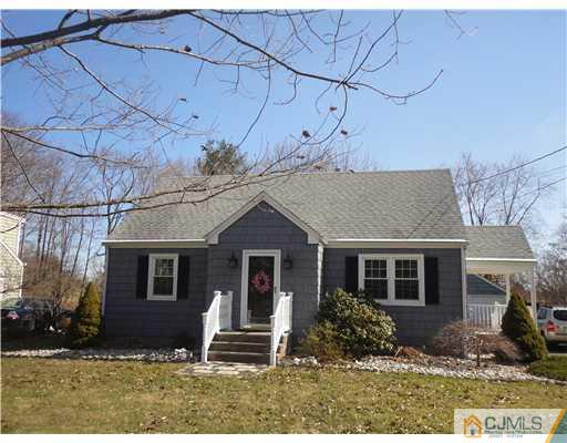 290 Georges Road Dayton, NJ 08810 - Photo 1 of 22 front view of a house with a yard
