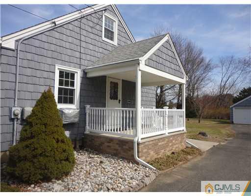 290 Georges Road Dayton, NJ 08810 - Photo 2 of 22 a front view of a house with a garden
