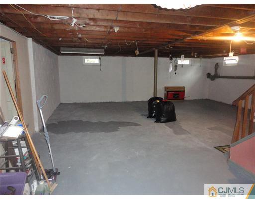 290 Georges Road Dayton, NJ 08810 - Photo 15 of 22 a view of car parked in garage