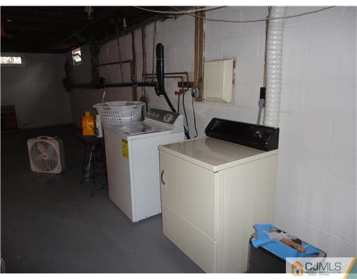 290 Georges Road Dayton, NJ 08810 - Photo 18 of 22 a utility room with dryer and washer