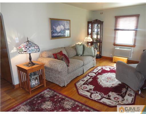 290 Georges Road Dayton, NJ 08810 - Photo 5 of 22 a living room with furniture rug and window
