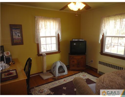 290 Georges Road Dayton, NJ 08810 - Photo 10 of 22 a view of a workspace with furniture and a window