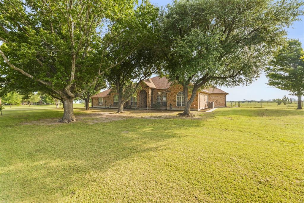 130 Blazek Road Alma, TX 75119 - Photo 4 of 34 a house view with swimming pool