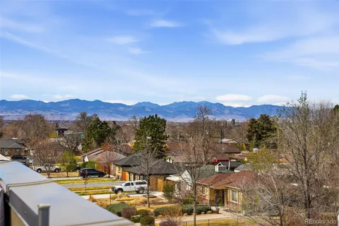 a view of a town with mountains in the background