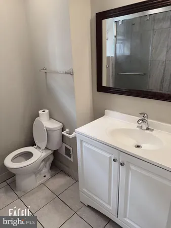 a bathroom with a glass shower door