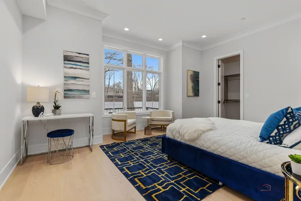 a bedroom with a bed and a table