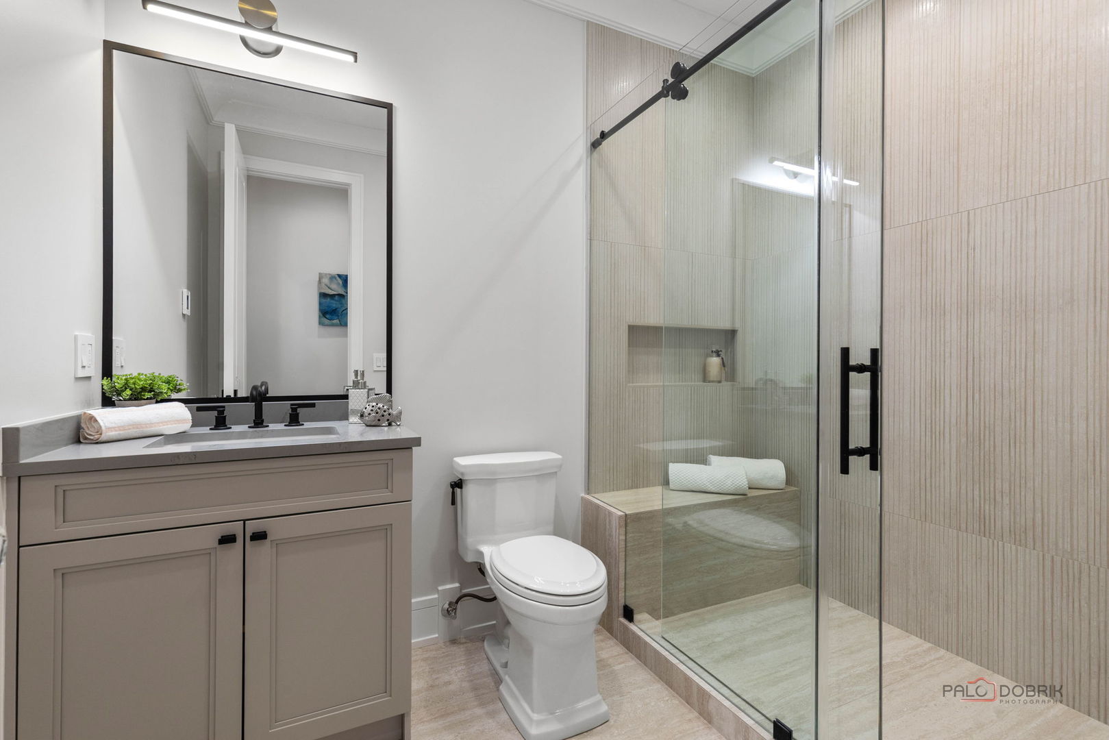 3890 Greenacre Drive Northbrook, IL 60062 - Photo 18 of 37 a bathroom with a toilet a sink and glass door