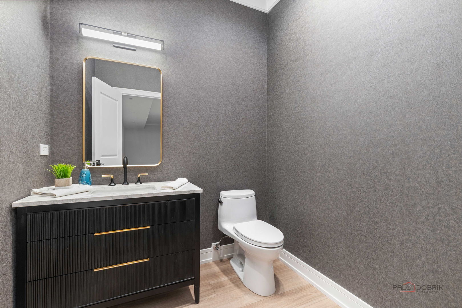 3890 Greenacre Drive Northbrook, IL 60062 - Photo 36 of 37 a bathroom with a toilet sink and mirror