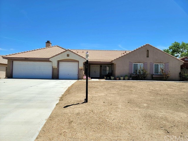 12915 Lompoc Road Apple Valley, CA 92308 - Photo 2 of 23 a front view of a house with a yard