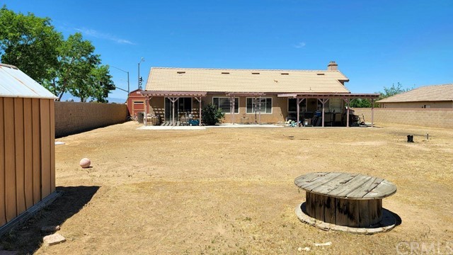 12915 Lompoc Road Apple Valley, CA 92308 - Photo 22 of 23 a view of a white house with a yard